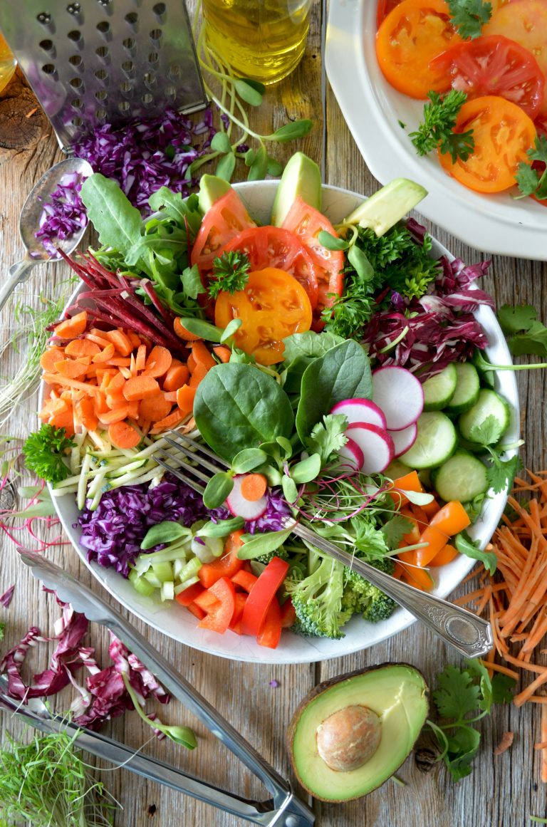 Fresh vegetable salad with radish and leafy greens