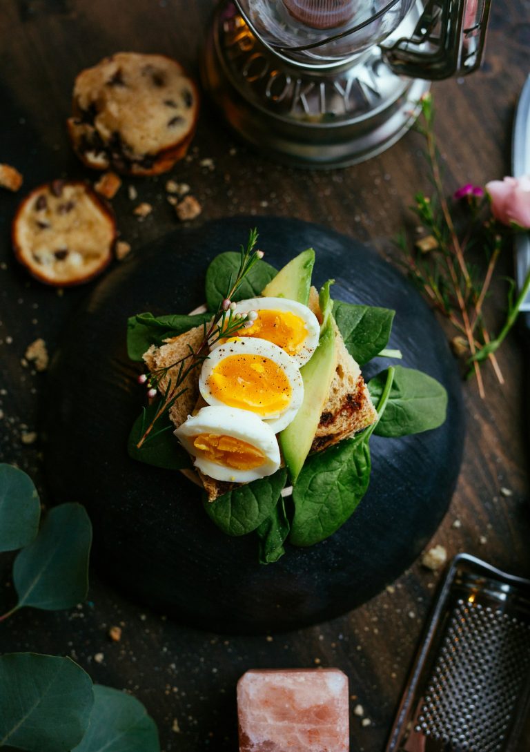 Eggs, avocado and greens on toast