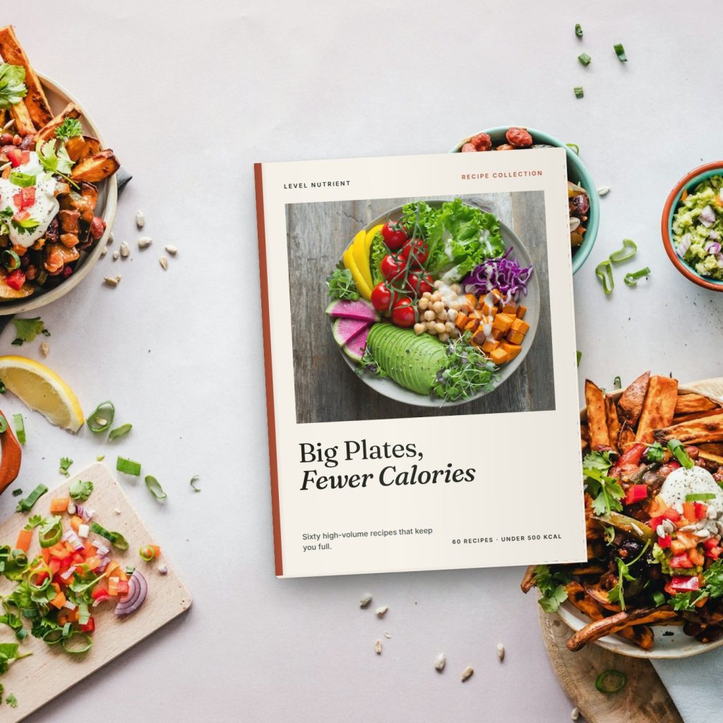Printed Level Nutrient fat loss recipe collection booklet on a kitchen table
