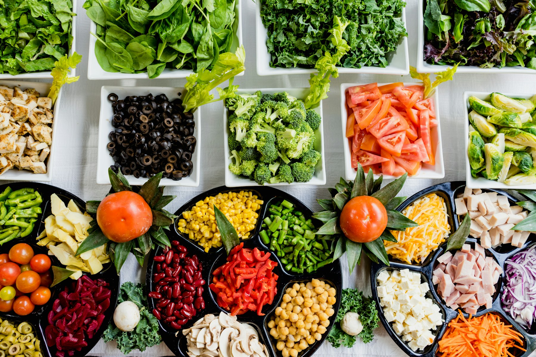 Colorful ingredients arranged in bowls and trays