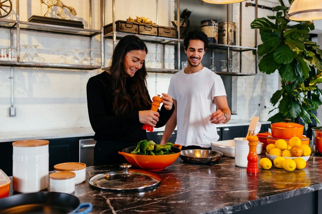 Couple cooking together in a home kitchen