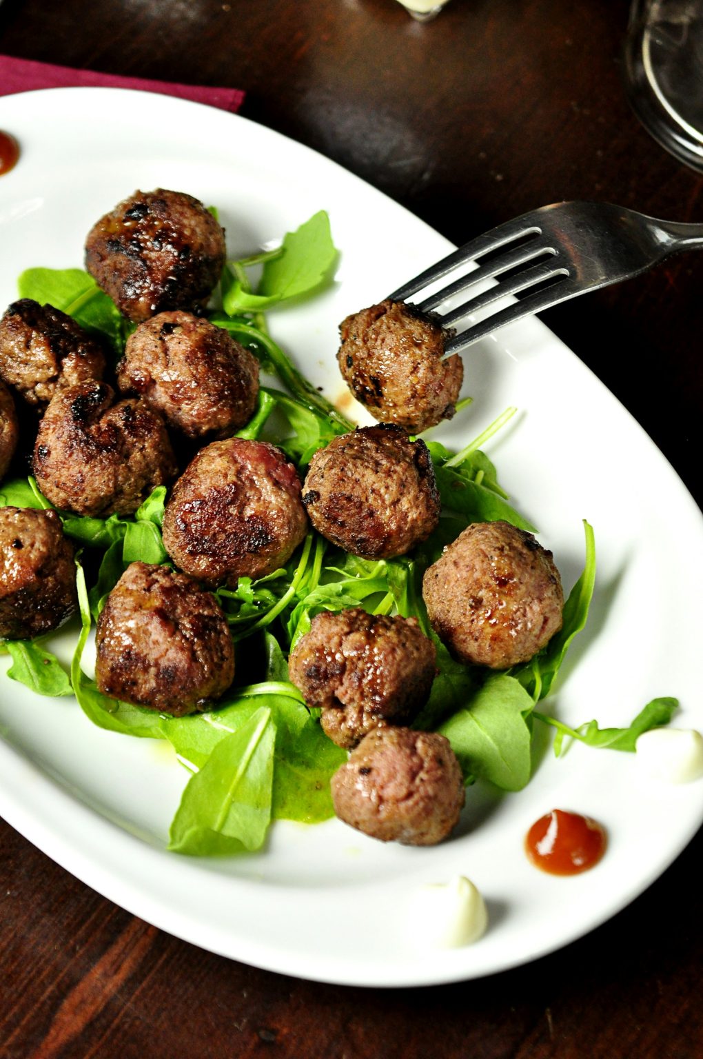 Turkey meatballs served on a bed of fresh greens
